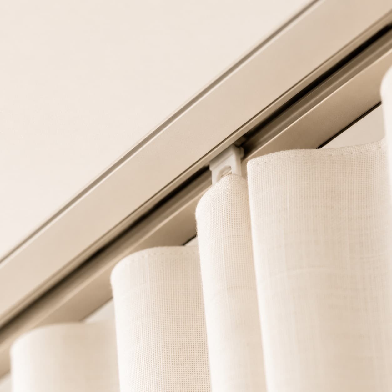 Curtain glides running in a recessed ceiling track